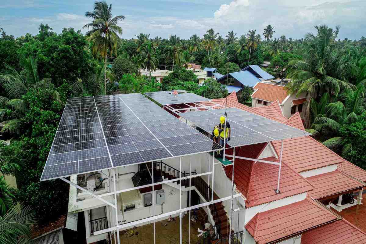  A residential home in Jaipur, Rajasthan, equipped with solar panels on the roof, promoting eco-friendly energy practices.